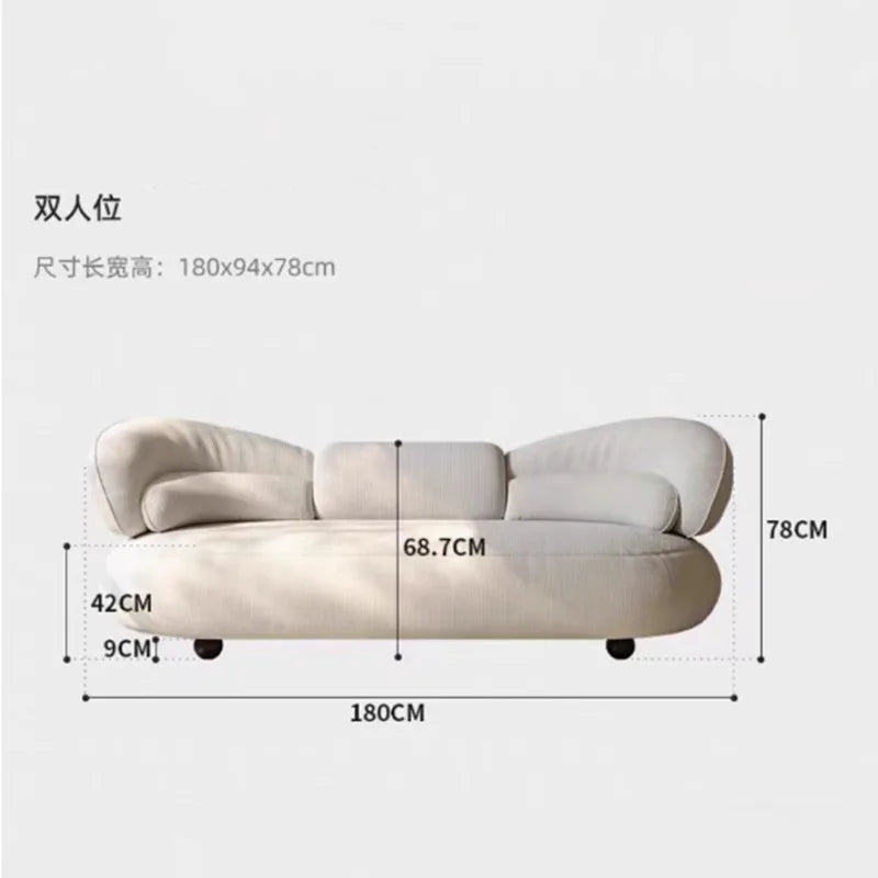 Italian creative sofa designer light luxury high-end curved sofa special-shaped cream wind fabric sofa