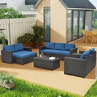 beige rattan wicker outdoor patio sectional set with coffee table and two pillows