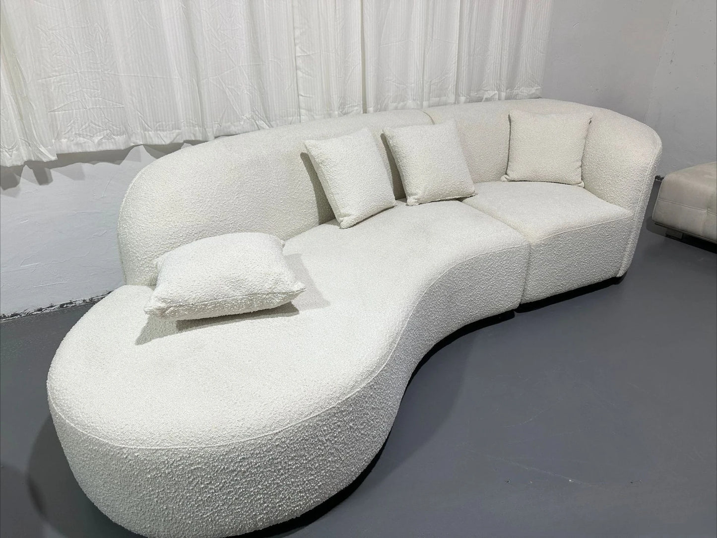 Italian minimalist sofa small apartment light luxury curved sofa moon arc cashew cream style fabric