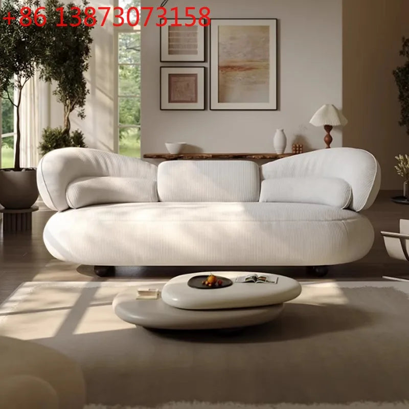 Italian creative sofa designer light luxury high-end curved sofa special-shaped cream wind fabric sofa