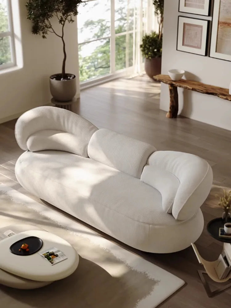 Italian creative sofa designer light luxury high-end curved sofa special-shaped cream wind fabric sofa