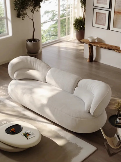 Italian creative sofa designer light luxury high-end curved sofa special-shaped cream wind fabric sofa