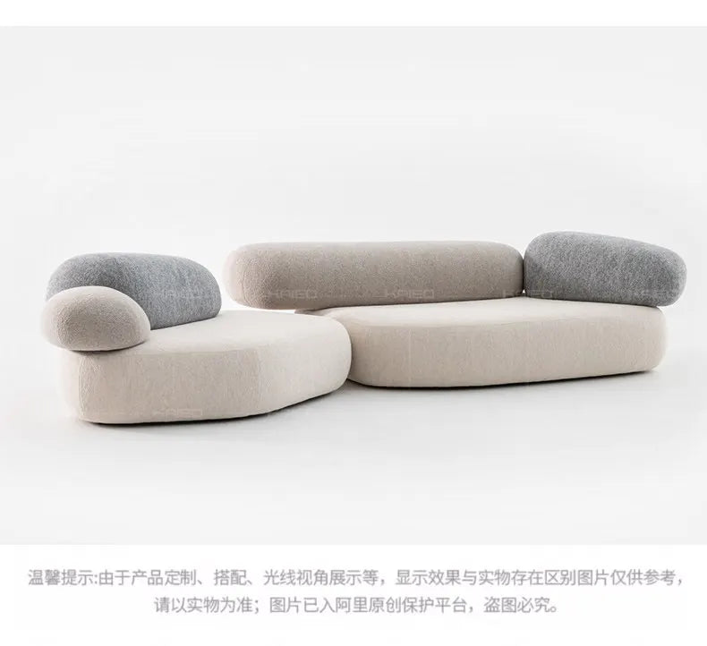 Design special-shaped pebble sofa, stone fabric color matching module wabi-sabi wind living room