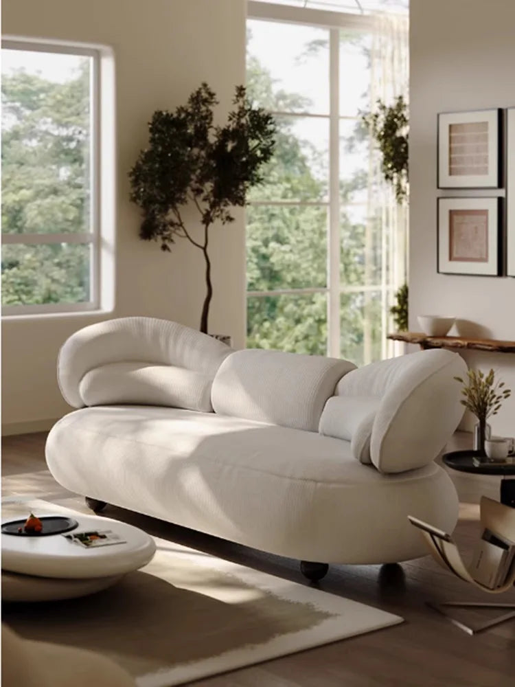 Italian creative sofa designer light luxury high-end curved sofa special-shaped cream wind fabric sofa