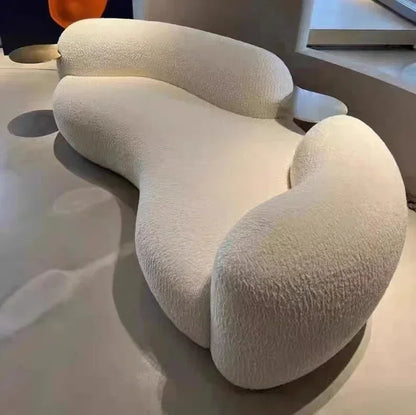 A Italian Minimalist With Curved Living Room, Lamb Velvet Clothing Store, Reception, Pea Sofa, Cream, And Quiet Breeze