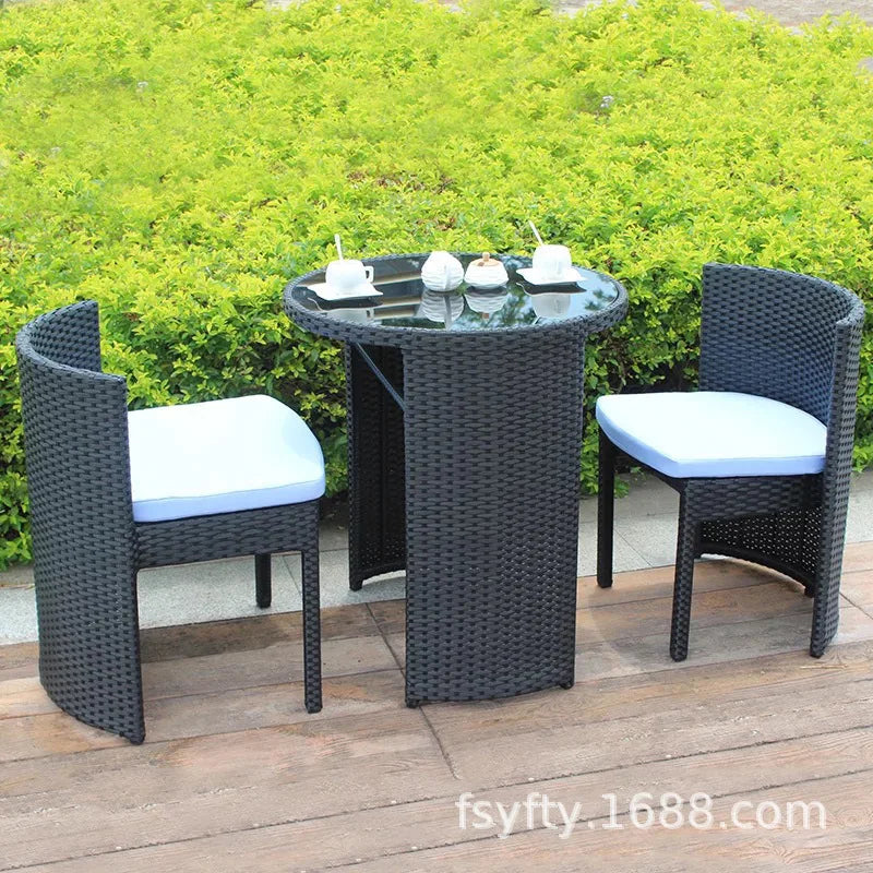 Outdoor rattan chair table and chair three-piece balcony garden creative simple rattan leisure table and chair combination