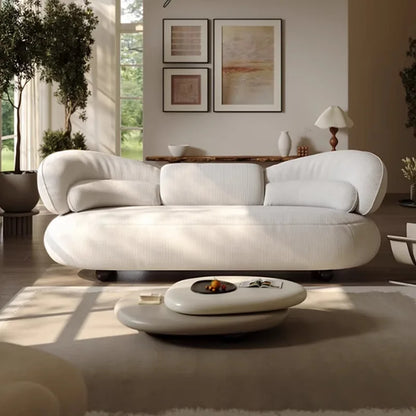 Italian creative sofa designer light luxury high-end curved sofa special-shaped cream wind fabric sofa