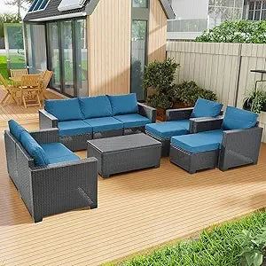 beige rattan wicker outdoor patio sectional set with coffee table and two pillows