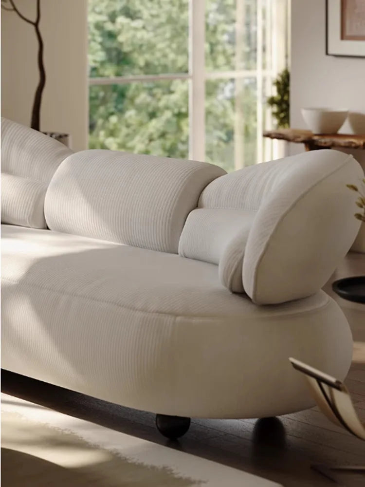 Italian creative sofa designer light luxury high-end curved sofa special-shaped cream wind fabric sofa