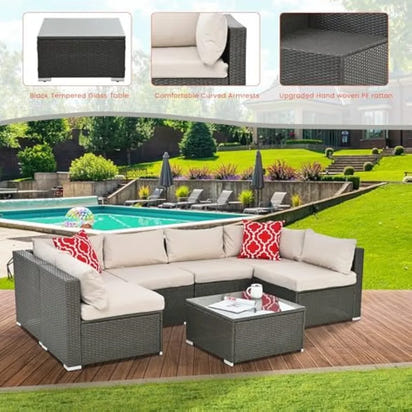 beige rattan wicker outdoor patio sectional set with coffee table and two pillows