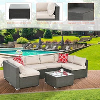 beige rattan wicker outdoor patio sectional set with coffee table and two pillows