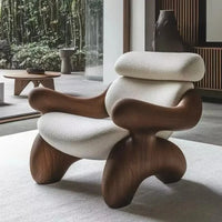 Modern and elegant armchair for adults, made of wood, in a simple Nordic style, ideal for the living room, reading, balcony, or hotel. Trendy and stylish living room furniture